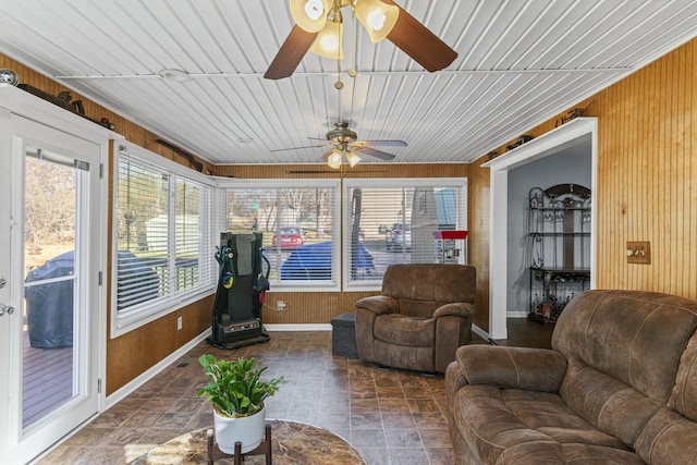 sunroom featuring ceiling fan