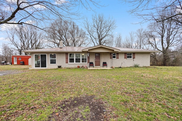 2641 S Grundy Quarles Hwy, Gainesboro, TN 38562 - ranch-style home featuring brick siding, a chimney, metal roof, and a front lawn