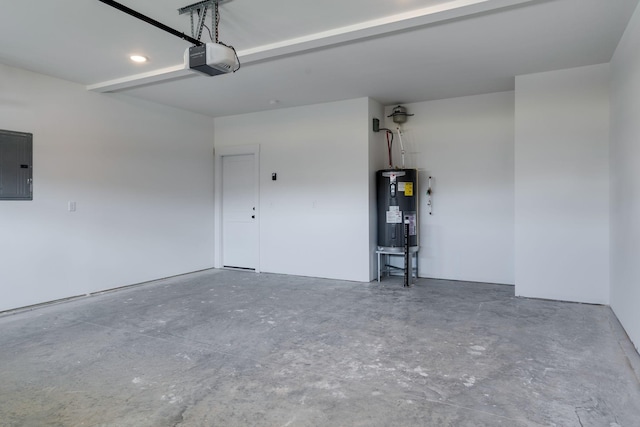 garage featuring a garage door opener, electric panel, and electric water heater