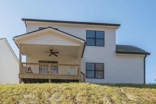 rear view of property with ceiling fan