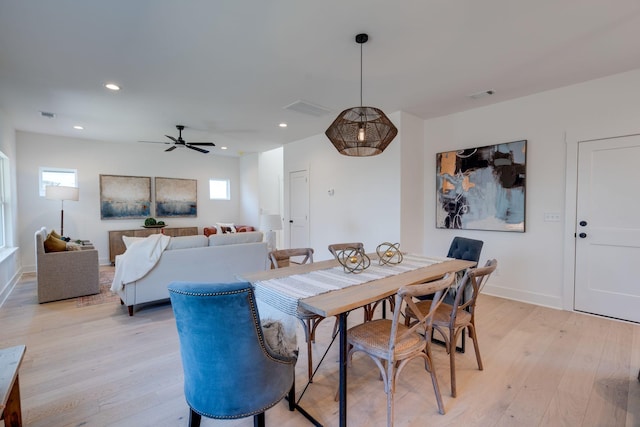 dining space with a wealth of natural light and light hardwood / wood-style floors