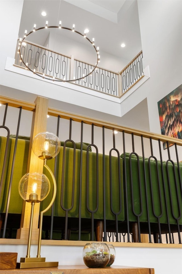 staircase with a towering ceiling