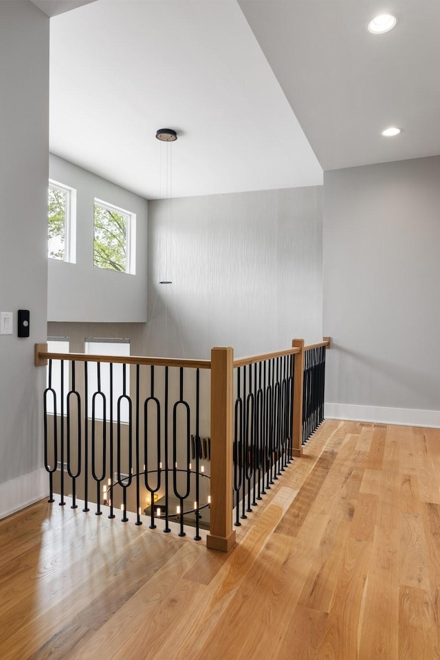 stairs featuring hardwood / wood-style flooring