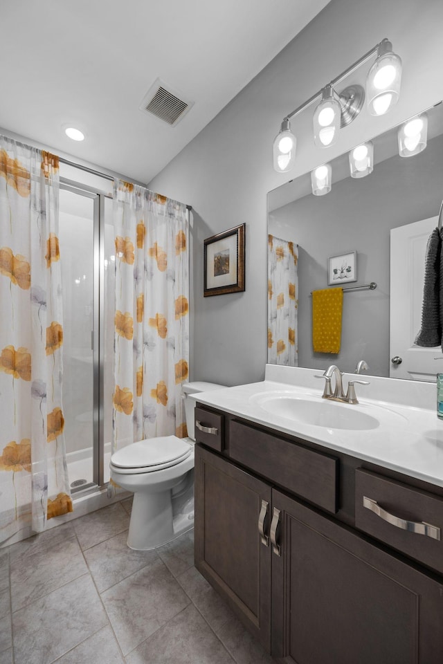 bathroom featuring vanity, curtained shower, and toilet