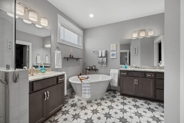 bathroom with vanity and a bathtub