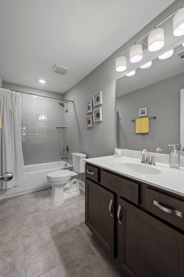 full bathroom with shower / tub combo with curtain, vanity, and toilet