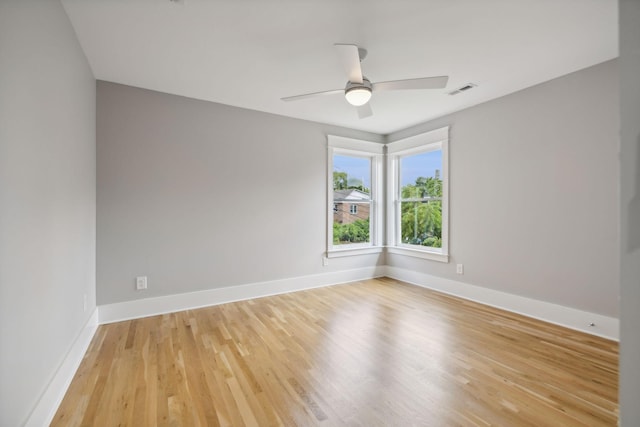 spare room with ceiling fan and light hardwood / wood-style flooring