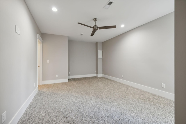 unfurnished room with ceiling fan and light carpet