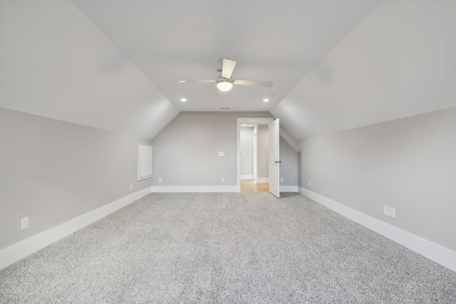 bonus room featuring ceiling fan, lofted ceiling, and carpet flooring