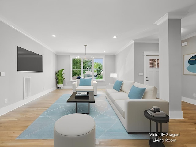 living room featuring crown molding, a chandelier, and hardwood / wood-style floors