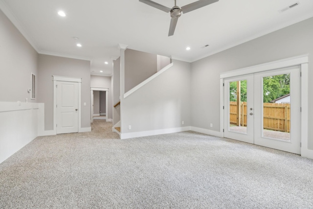 unfurnished living room with french doors, ceiling fan, ornamental molding, and light carpet