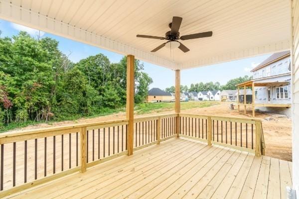 wooden deck featuring ceiling fan