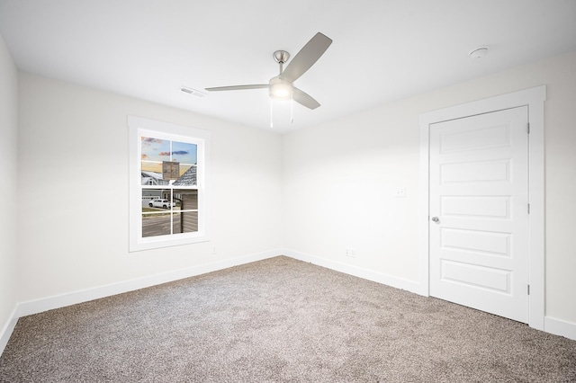 carpeted empty room with ceiling fan