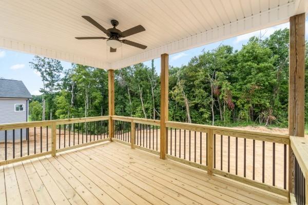 wooden terrace featuring ceiling fan