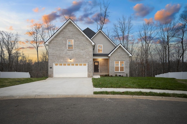 view of front of house featuring a garage and a lawn