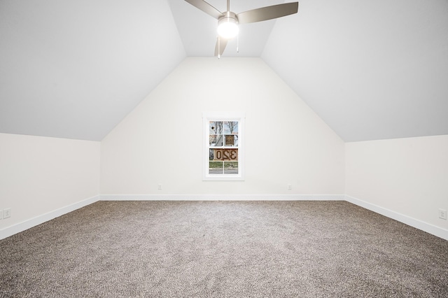 additional living space with lofted ceiling, carpet, and ceiling fan