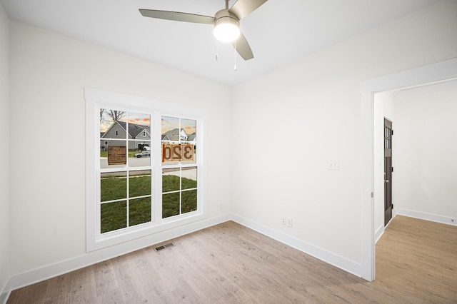 spare room featuring ceiling fan and light hardwood / wood-style floors