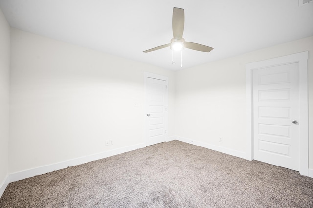 empty room featuring ceiling fan and carpet flooring