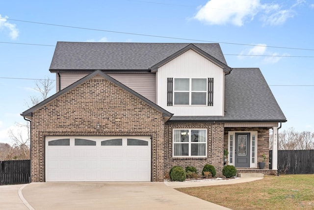 view of front property with a garage and a front yard