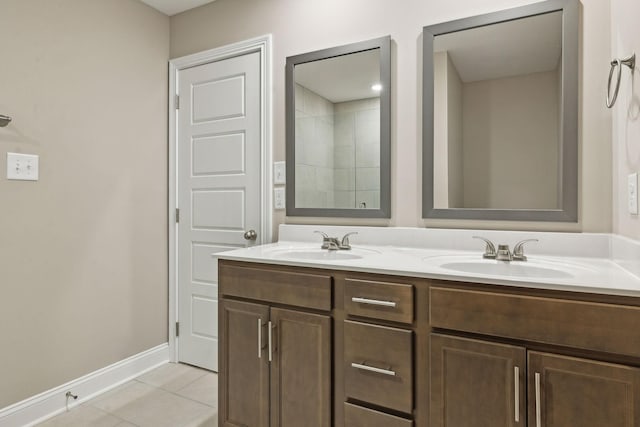 bathroom featuring tile patterned flooring and vanity