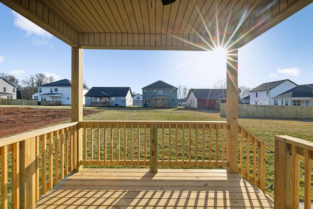 wooden deck featuring a yard