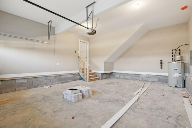 garage with a garage door opener and electric water heater