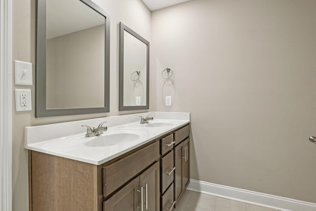 bathroom with vanity and tile patterned flooring