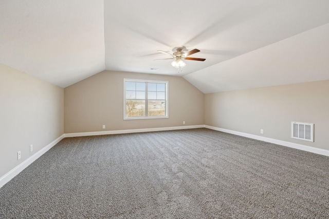 bonus room featuring lofted ceiling, ceiling fan, and carpet