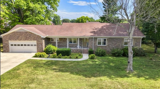 single story home featuring a garage, a front lawn, and a porch