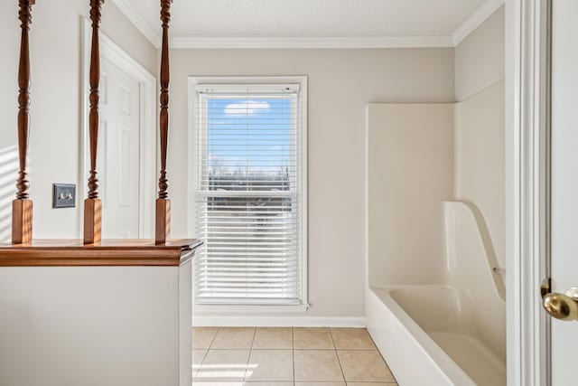 bathroom featuring crown molding, tile patterned flooring, and a wealth of natural light