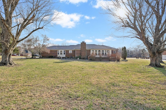 exterior space with a wooden deck and a front yard