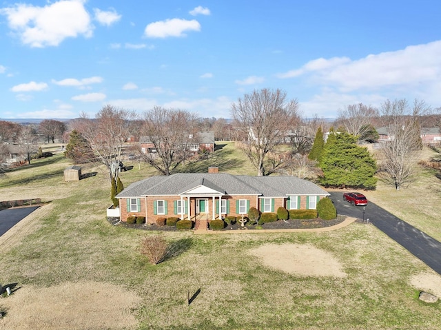 single story home featuring a front yard