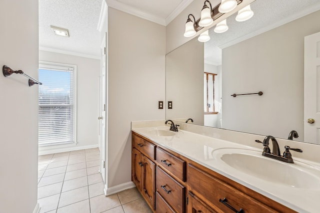 bathroom with tile patterned flooring, crown molding, vanity, and a textured ceiling