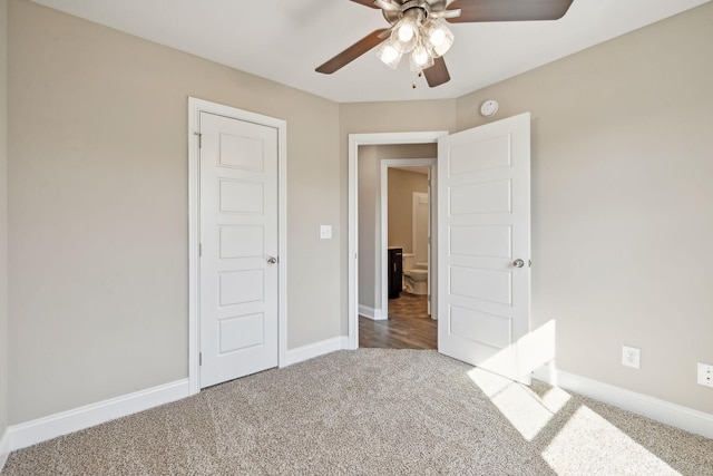 unfurnished bedroom featuring carpet floors and ceiling fan