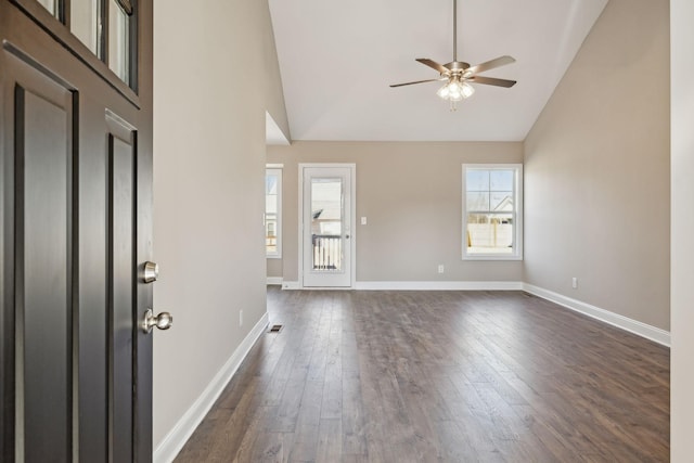 entryway featuring dark wood-type flooring, ceiling fan, and high vaulted ceiling