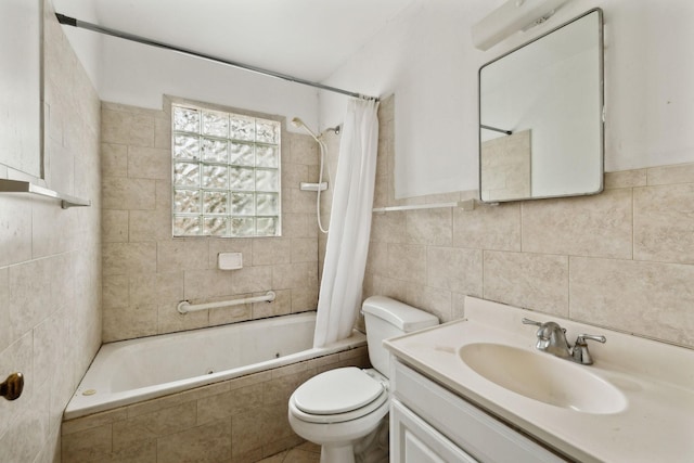 full bathroom featuring toilet, vanity, shower / bathtub combination with curtain, and tile walls