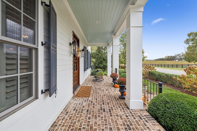 view of patio / terrace with a rural view