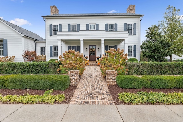 colonial home with a porch