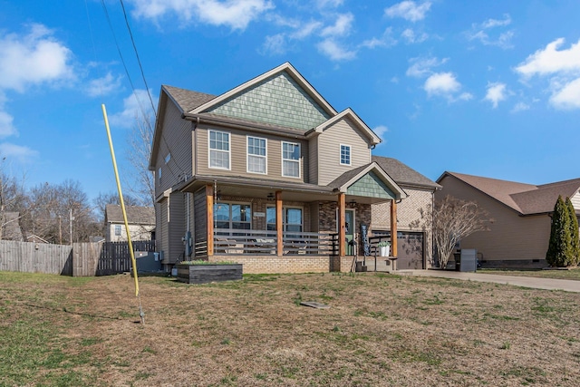 view of front of house with a porch and a front yard