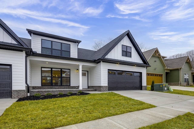 modern farmhouse style home with a garage and a front lawn