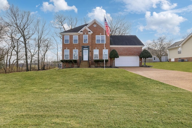 view of front of home featuring a garage, central AC, and a front yard