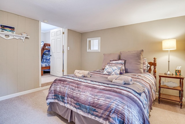 bedroom featuring light carpet