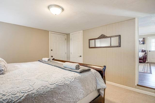 carpeted bedroom with a textured ceiling