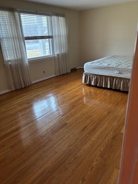 unfurnished bedroom featuring wood-type flooring