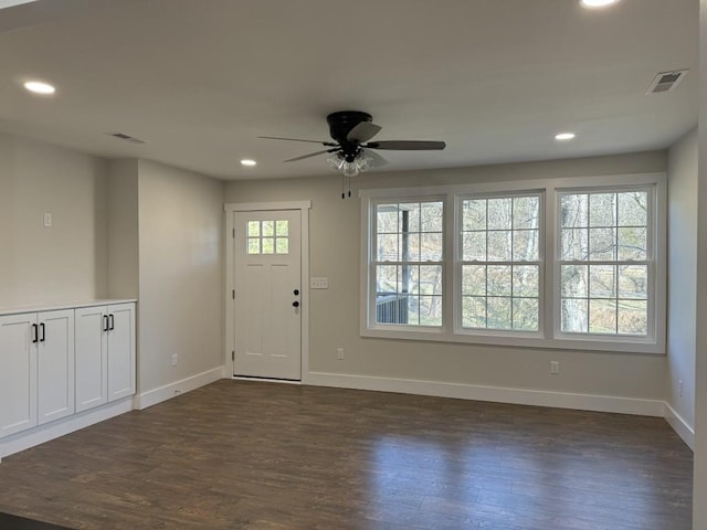 foyer entrance featuring ceiling fan and dark hardwood / wood-style floors