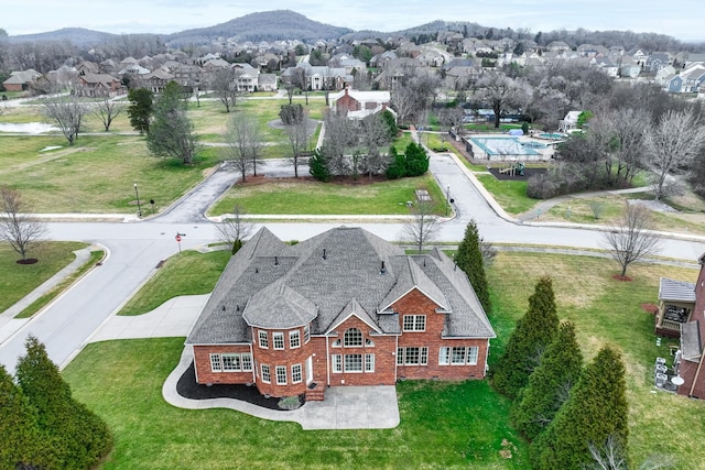 birds eye view of property with a residential view and a mountain view