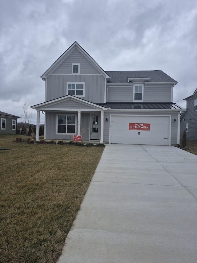 view of front facade with a garage and a front lawn