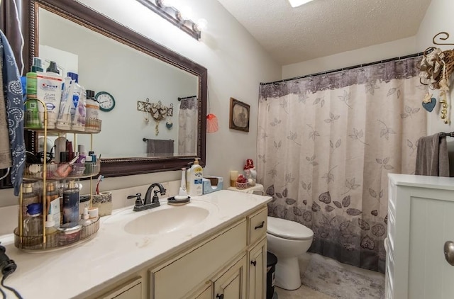 bathroom with vanity, curtained shower, a textured ceiling, and toilet