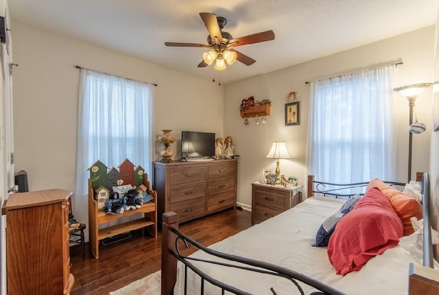 bedroom featuring dark hardwood / wood-style floors and ceiling fan