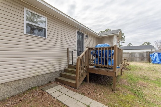 doorway to property with a lawn